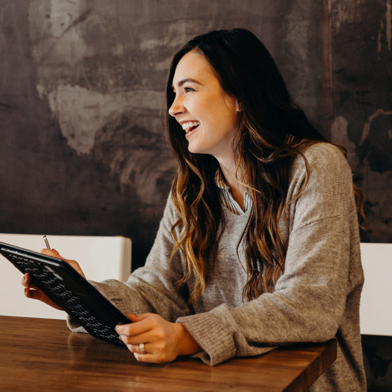 Smiling girl with tablet